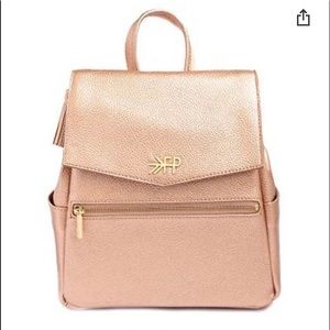 Freshly picked classic MINI rose gold diaper bag.